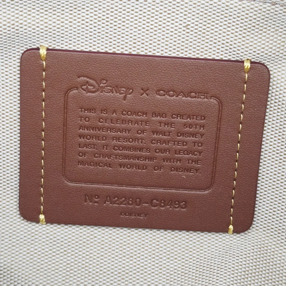 DISNEY X COACH DUFFLE BAG - SIGNATURE TEXTILE JACQUARD MICKEY MOUSE AND FRIENDS